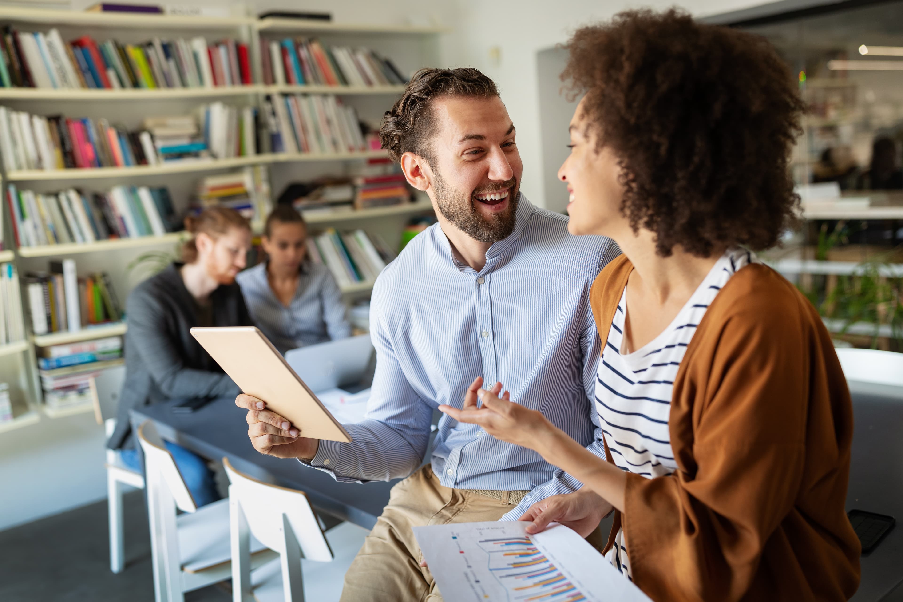 Teachers collaborating in modern workspace